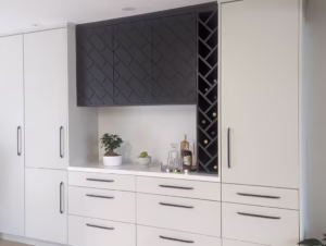 Contemporary two-tone kitchen pantry featuring white and dark grey custom cabinets with white quartz countertop by Polymita Woodcraft